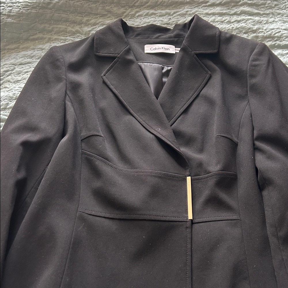 Calvin Klein Black Blazer with Gold Bar (snap) closure
For flair. Size 14